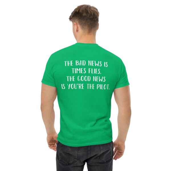 A man wearing a green shirt with the words " for those things is times fours, the good news is yours too miles ".